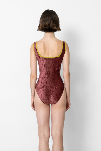 Marieke leotard in CV-Garnet body color with N-Cricket trim color