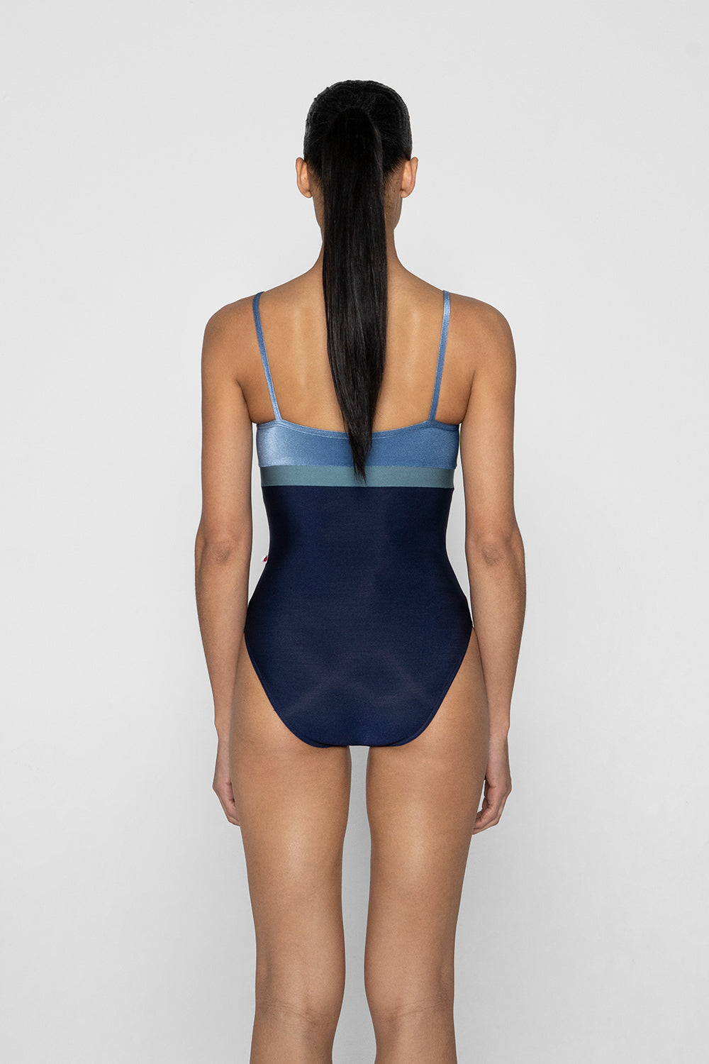Zoe leotard in N-Dark Blue body color with V-Ocean top & trim color and N-Frost middle band color