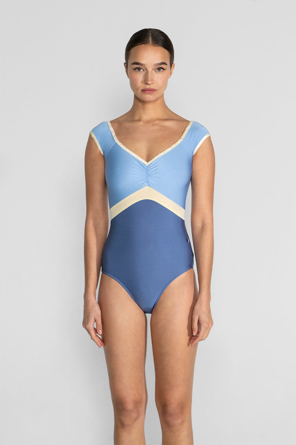 Elli Variation 1 leotard in N-Arctic body color with N-Moontide top color, CV-Vanilla trim color and T-Vanilla middle band color