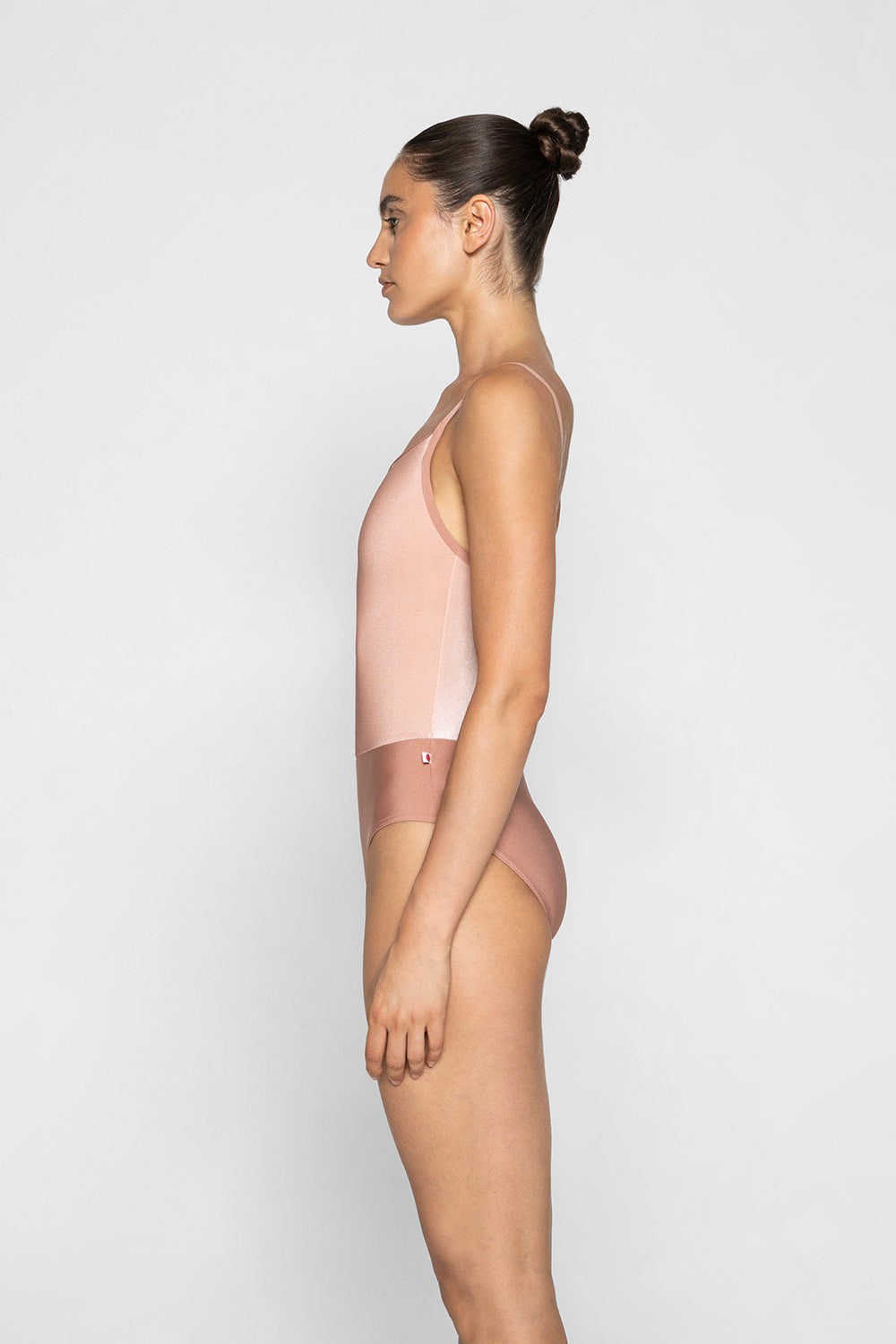 Kayoko leotard in N-Rosewood boyd & trim color with V-Meadow right panel color and V-Blush left panel color