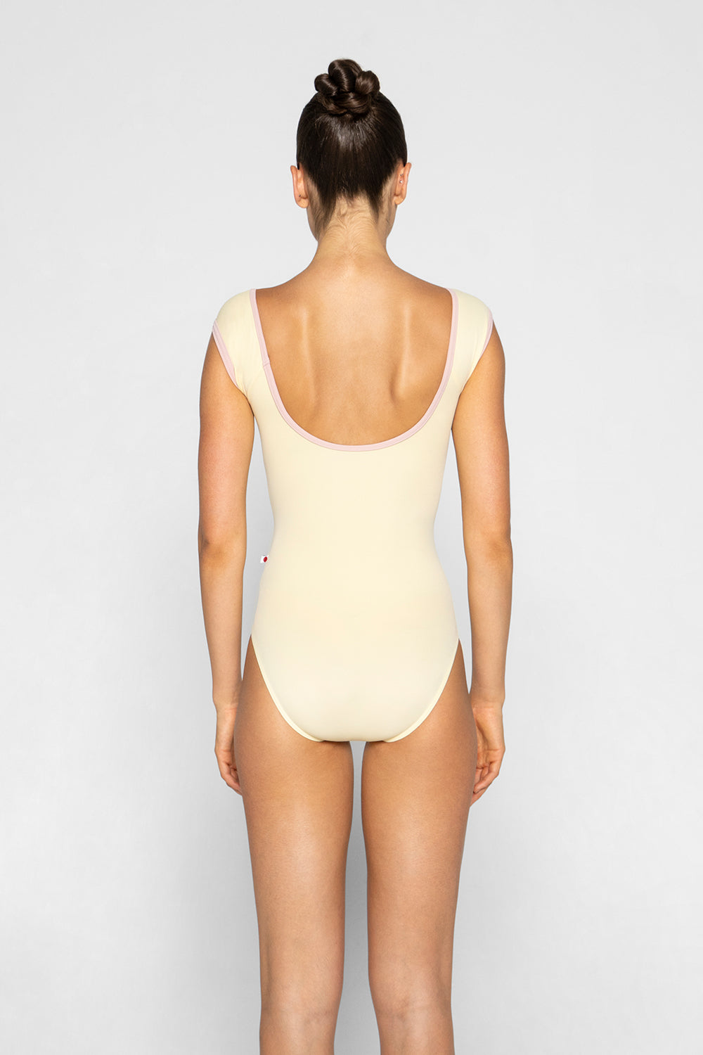 Wendy leotard in T-Vanilla body color with T-Petal trim color