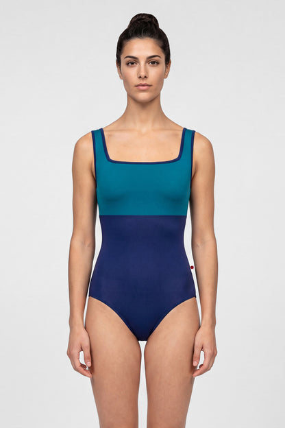 AI-generated model. Marieke leotard, teal square-neck bodice and a navy body with navy trim.