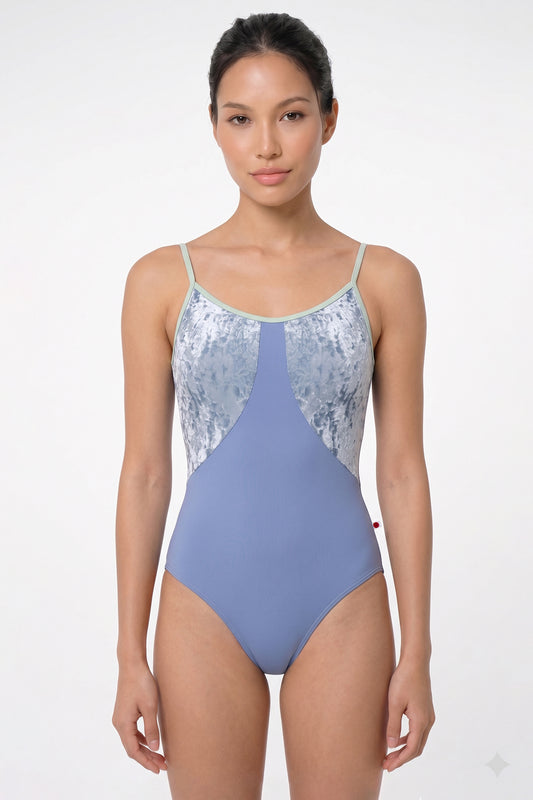 AI-generated model. Amanda leotard, silver-grey shimmer body color and a dusty blue-grey top with sage-green thin straps.