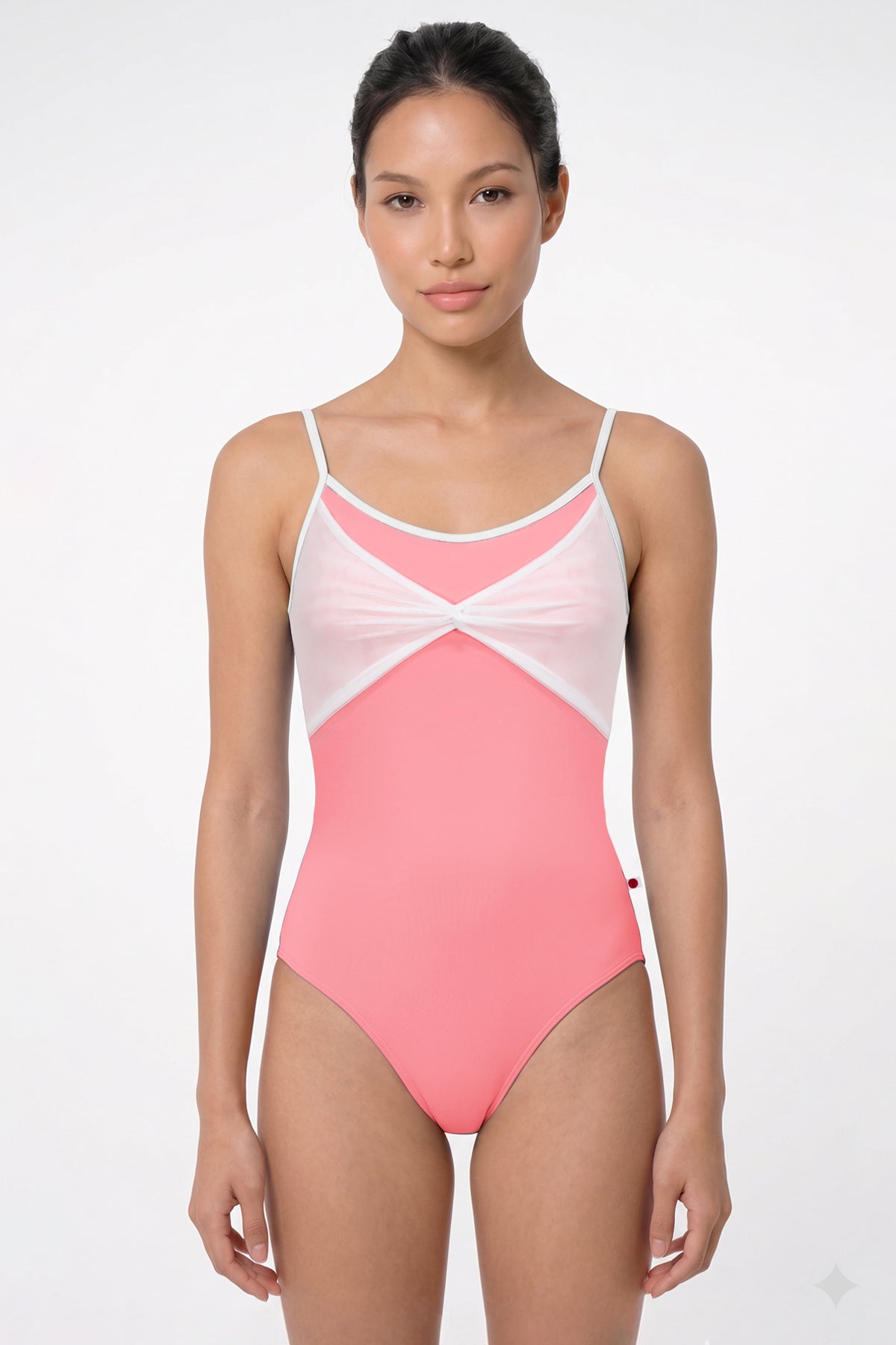 AI-generated model. Kathy leotard, coral-pink with a gathered white mesh bust panel and white trim.