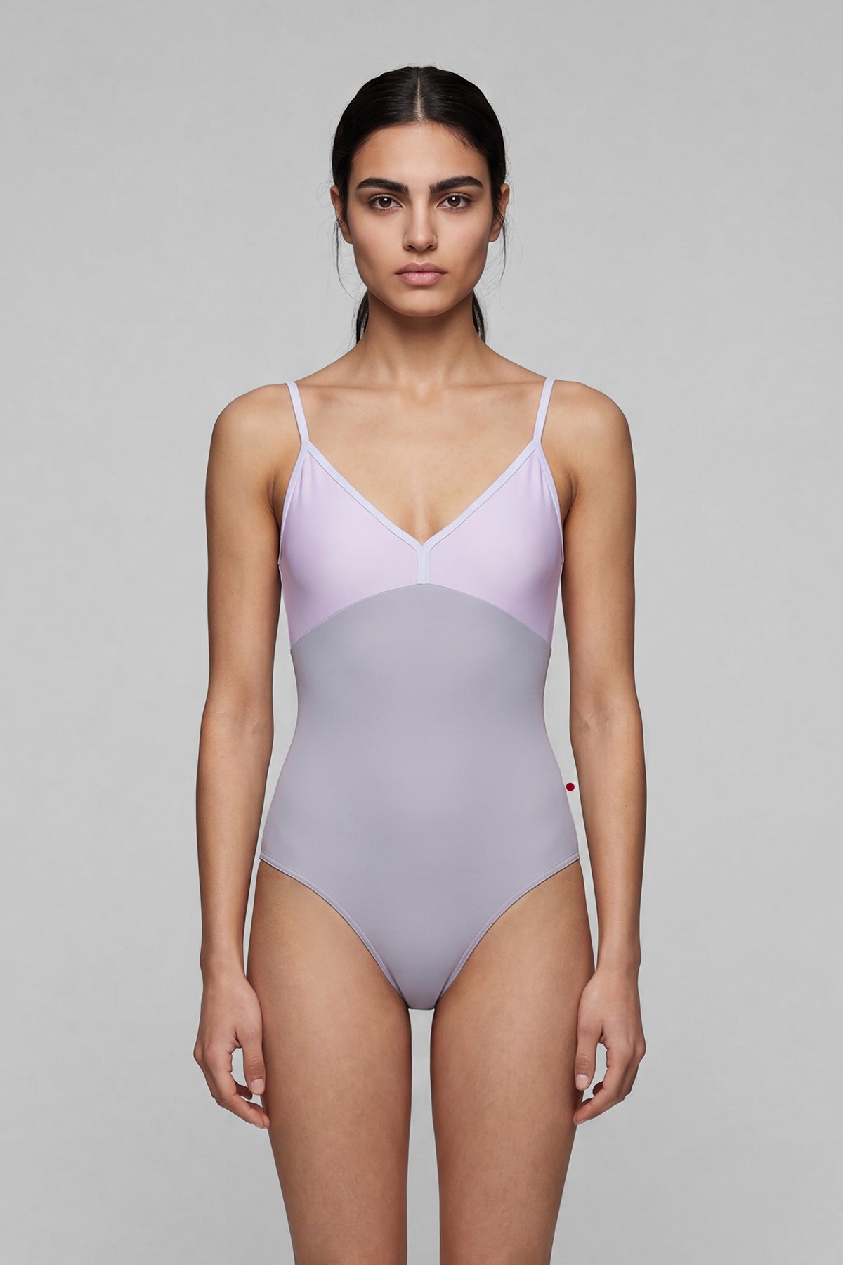 AI-generated model. Daria leotard, lilac bodice and a grey body with a V-neckline and thin straps.