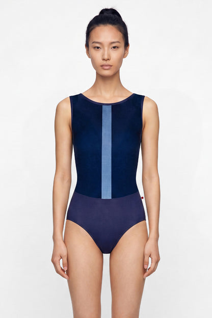 AI-generated model. Didi leotard, navy with a pale-blue vertical centre stripe and a high boat neckline.