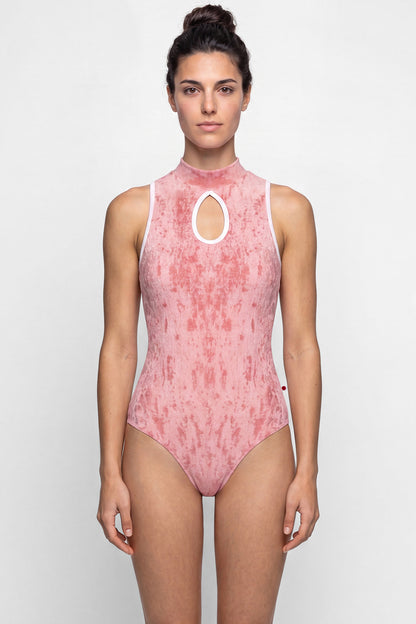 AI-generated model. Elise leotard, dusty-rose crushed velvet with a high neck and teardrop keyhole, white trim.