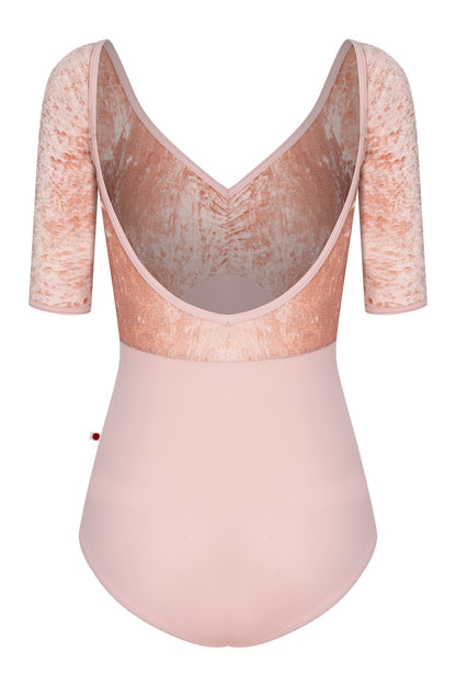 Elli leotard, blush-pink with a crushed-velvet elbow-sleeve bodice and gathered V-neck.