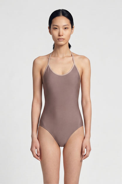 AI-generated model. Kate leotard, mauve-taupe with a scoop neckline and strappy back.