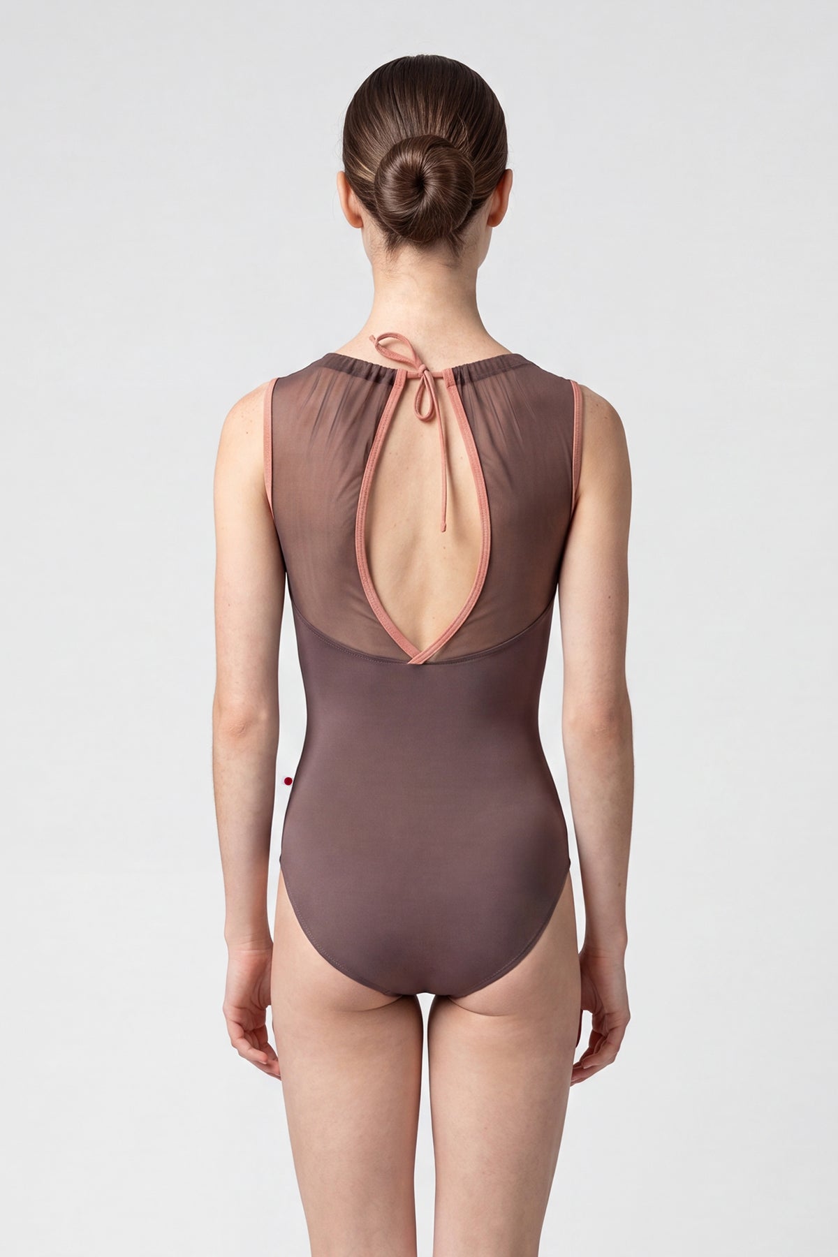 AI-generated model. Paris leotard in Phantom, mocha-brown with a sheer gathered mesh boat neckline. 