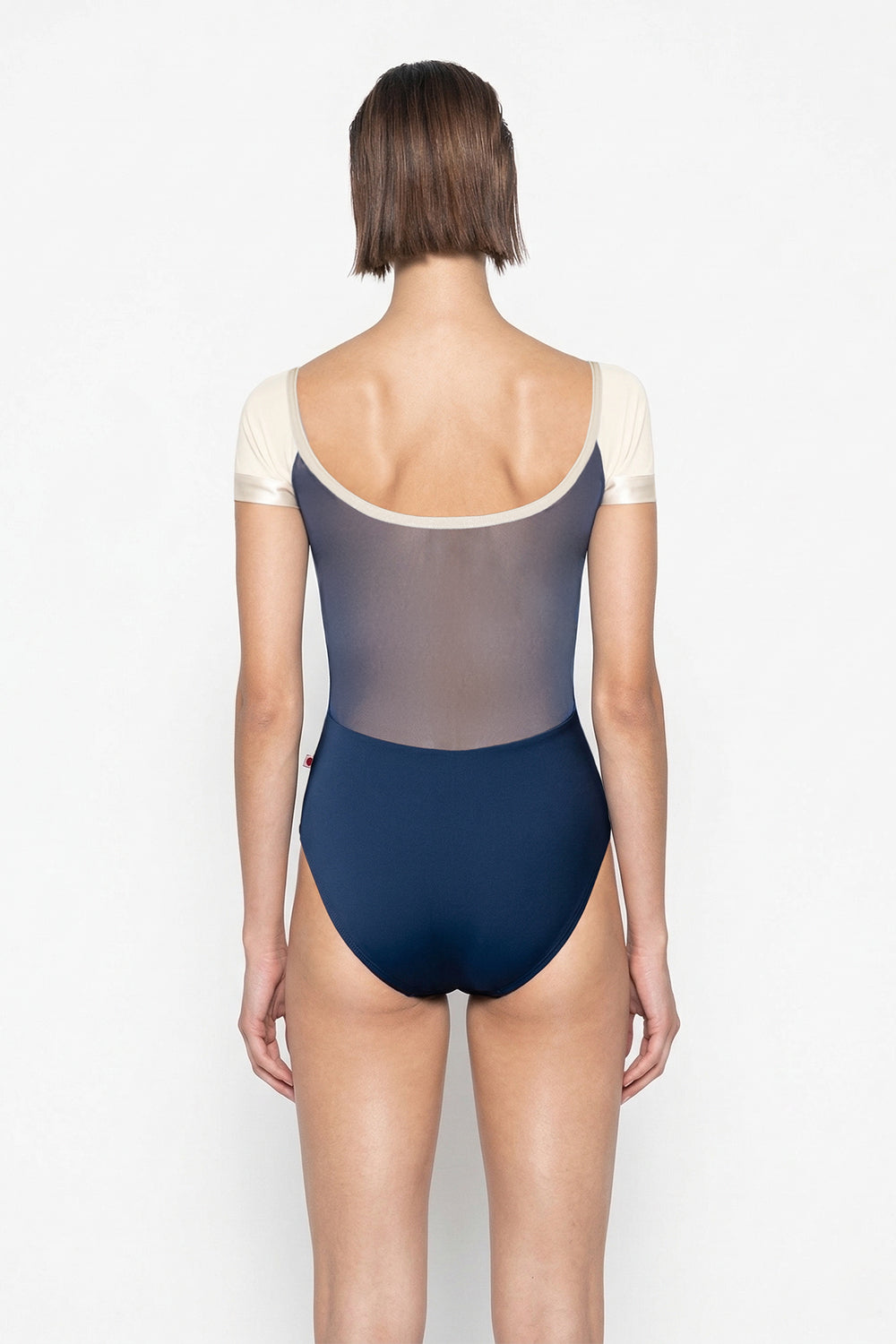 Chloe leotard in N-Dark Blue body color with Mesh Dark Blue top color, N-Pearl sleeves and zipper & V-Buttermilk trim color