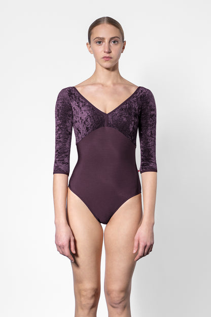 Alicia leotard in N-Eggplant body color with CV-Eggplant top color and N-Eggplant trim color. Features 3Q sleeves