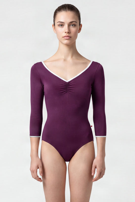 AI-generated model. Anna leotard, aubergine-purple with a ruched V-neck, silver trim and three-quarter sleeves.