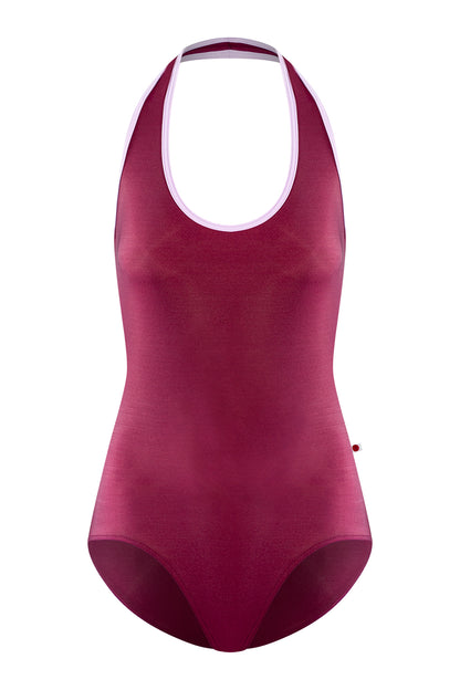 Jaione leotard, burgundy with a pale-pink halter neckline and open sides.