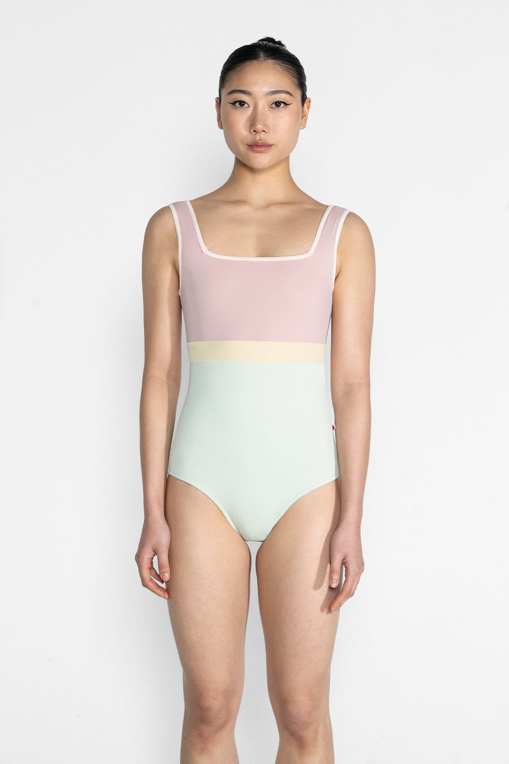 Marieke Variation 1 leotard in T-Pistachio body color with T-Petal top color, T-Misty Rose trim color and T-Vanilla middle band color