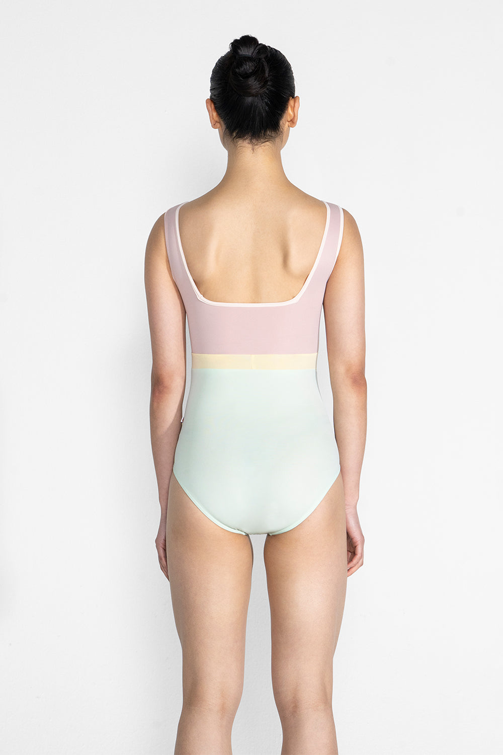 Marieke Variation 1 leotard in T-Pistachio body color with T-Petal top color, T-Misty Rose trim color and T-Vanilla middle band color