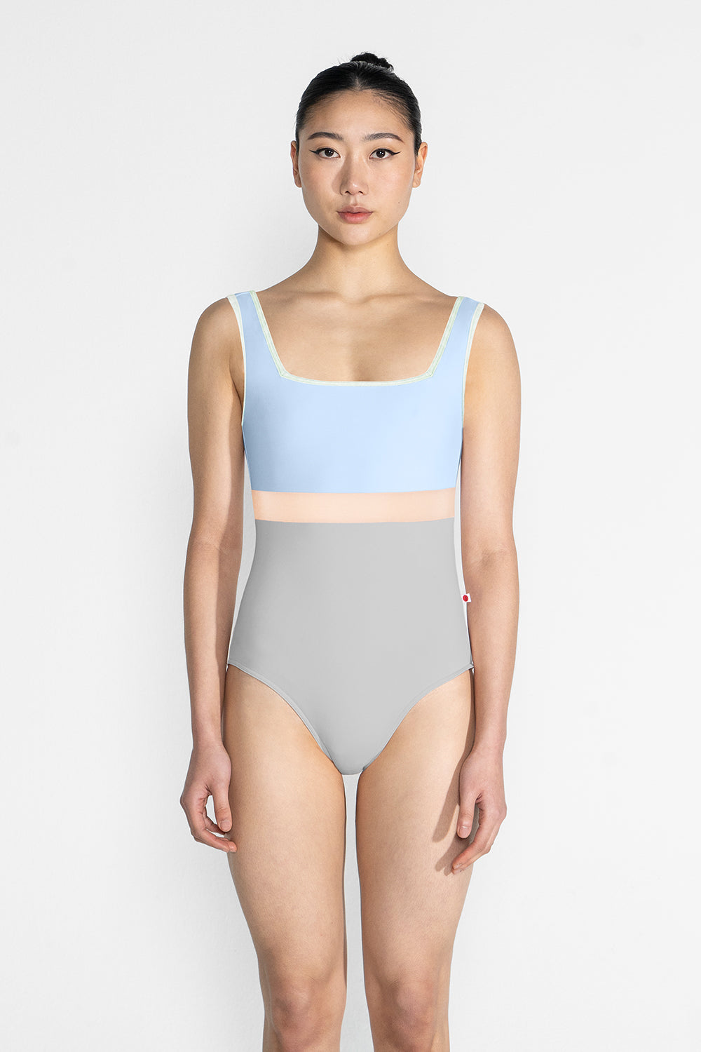 Marieke Variation 1 leotard in N-Silver body color with N-Moontide top color, CV-Pistachio trim color and N-Base middle band color